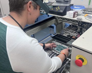 Leslie working on a machine